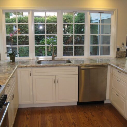 Full, white kitchen remodel with granite countertops