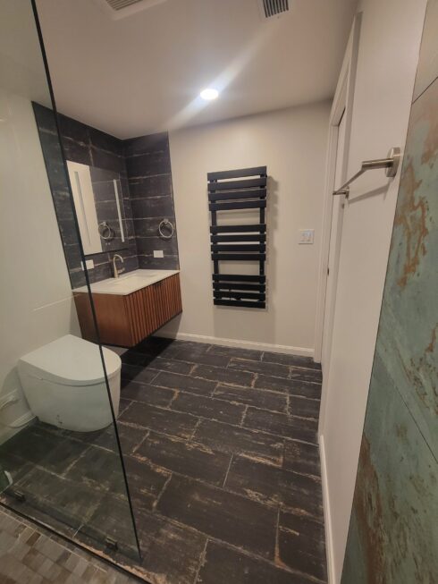 Floating sink in newly designed bathroom with JLQ Construction in California