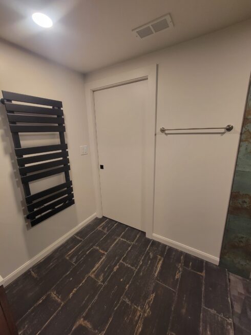 Modern towel racks in redesigned bathroom